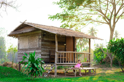 Wooden hut in yard of building