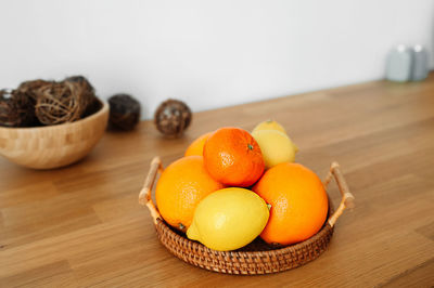 Close-up of fruits in basket on table