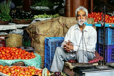 Portrait of a smiling young man in market