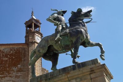 Low angle view of statue against sky