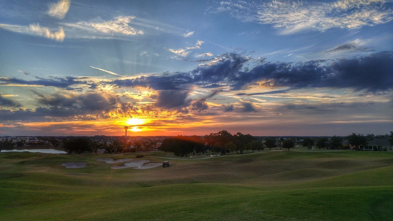 SCENIC VIEW OF FIELD AGAINST SKY AT SUNSET