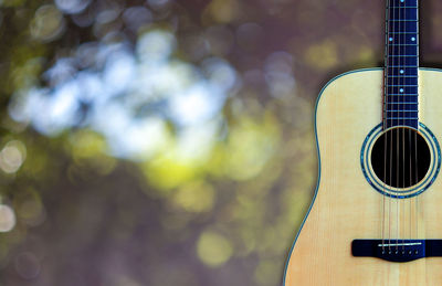 Close-up of guitar against blurred background