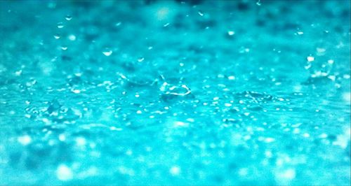 Full frame shot of water drops on swimming pool