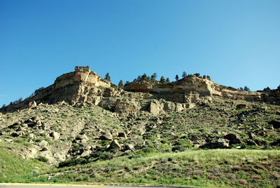 Scenic view of mountains against blue sky