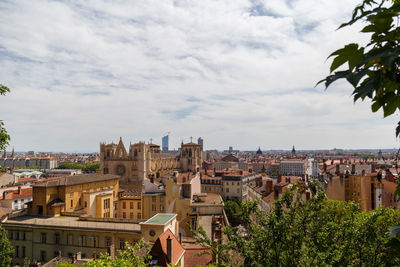 Buildings in city against sky