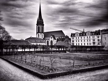 High angle view of church against cloudy sky