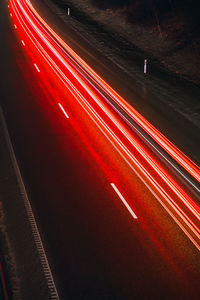 High angle view of light trails on road