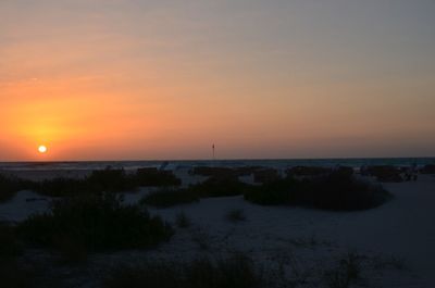 Scenic view of sea against romantic sky at sunset