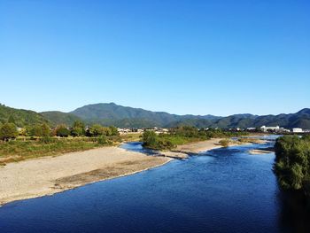 View of lake against blue sky