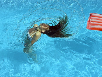 Woman swimming in pool