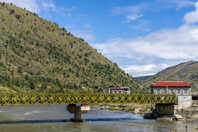 Bridge over river against sky