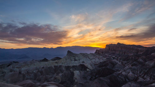 Scenic view of mountains against sky during sunset