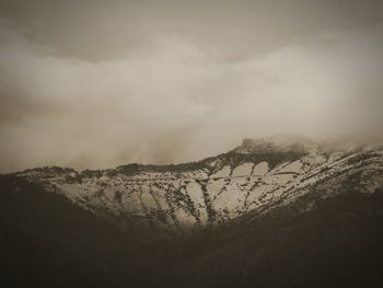 Scenic view of tree mountains against sky