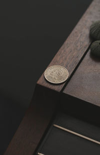 High angle view of coins on table