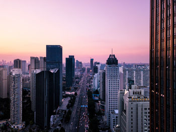 Cityscape against sky during sunset