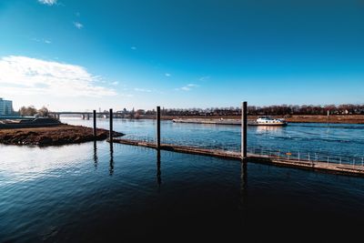 Scenic view of sea against blue sky