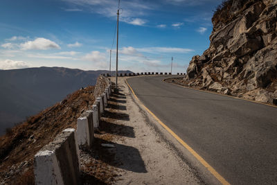 Himalayan breathtaking landscape with bright blue sky and twisty adventurous valley road