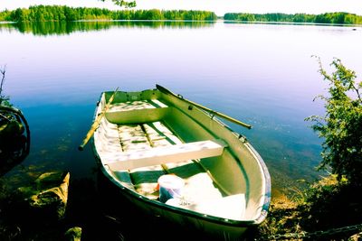 High angle view of boats moored in lake against sky