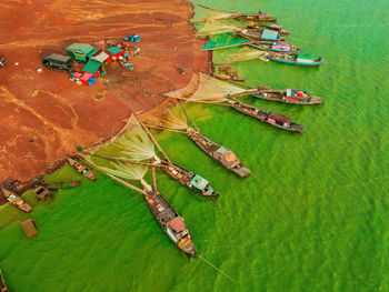 High angle view of boats moored on sea shore