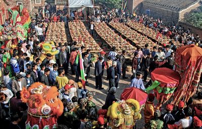 High angle view of crowd standing outdoors during festival