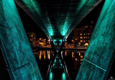 Illuminated bridge at night