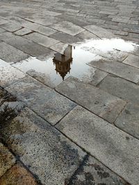 High angle view of puddle on street