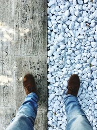 Low section of man standing on street