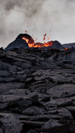 Scenic view of volcanic mountain against sky