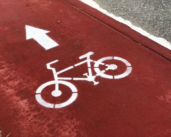 High angle view of arrow sign on road