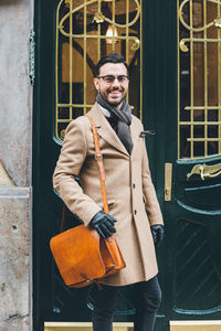 Portrait of young man standing outdoors