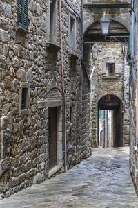 Alley amidst buildings in city