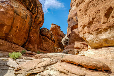 Low angle view of rock formation against sky