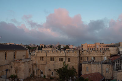 Early morning in the jerusalem. sunrise time. city view. old buildings. clouds on the sky