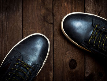 High angle view of shoes on wooden table