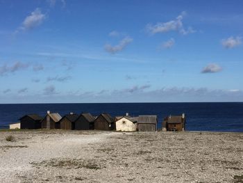 Built structure on beach against sky