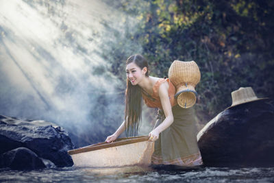 Woman wearing hat in basket