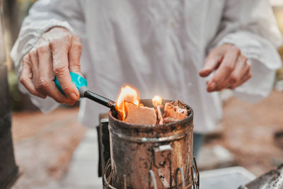 Midsection of man preparing food