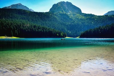 Scenic view of sea against mountains