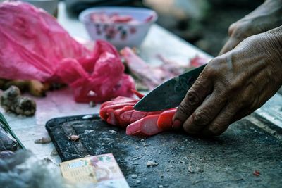 Cropped hand of person preparing food