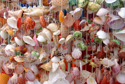 Close-up of decorations hanging for sale at market stall