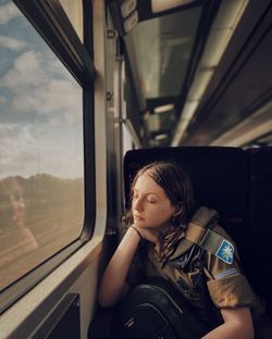 Man looking through train window