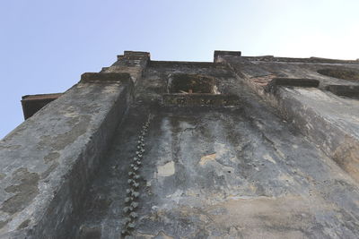 Low angle view of old building against sky