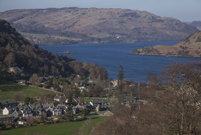 High angle view of townscape by mountains