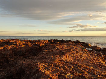 Scenic view of sea against sky at sunset