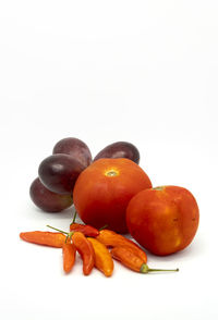 Close-up of oranges against white background