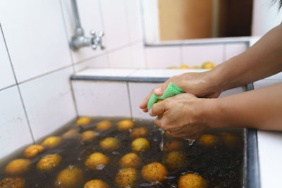 Midsection of man preparing food at home