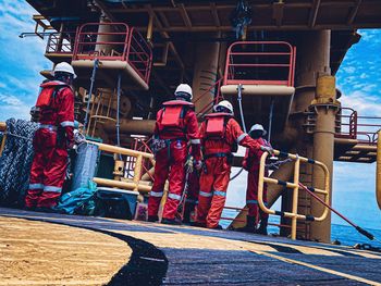 Rear view of people on boat