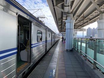 Train at railroad station in city