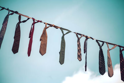 Low angle view of clothes hanging against clear sky