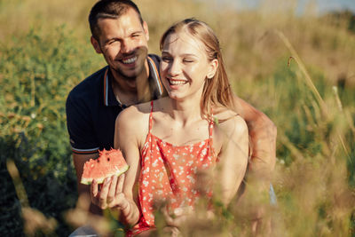 Young happy loving couple embracing and having fun together outdoors. young couple in love on